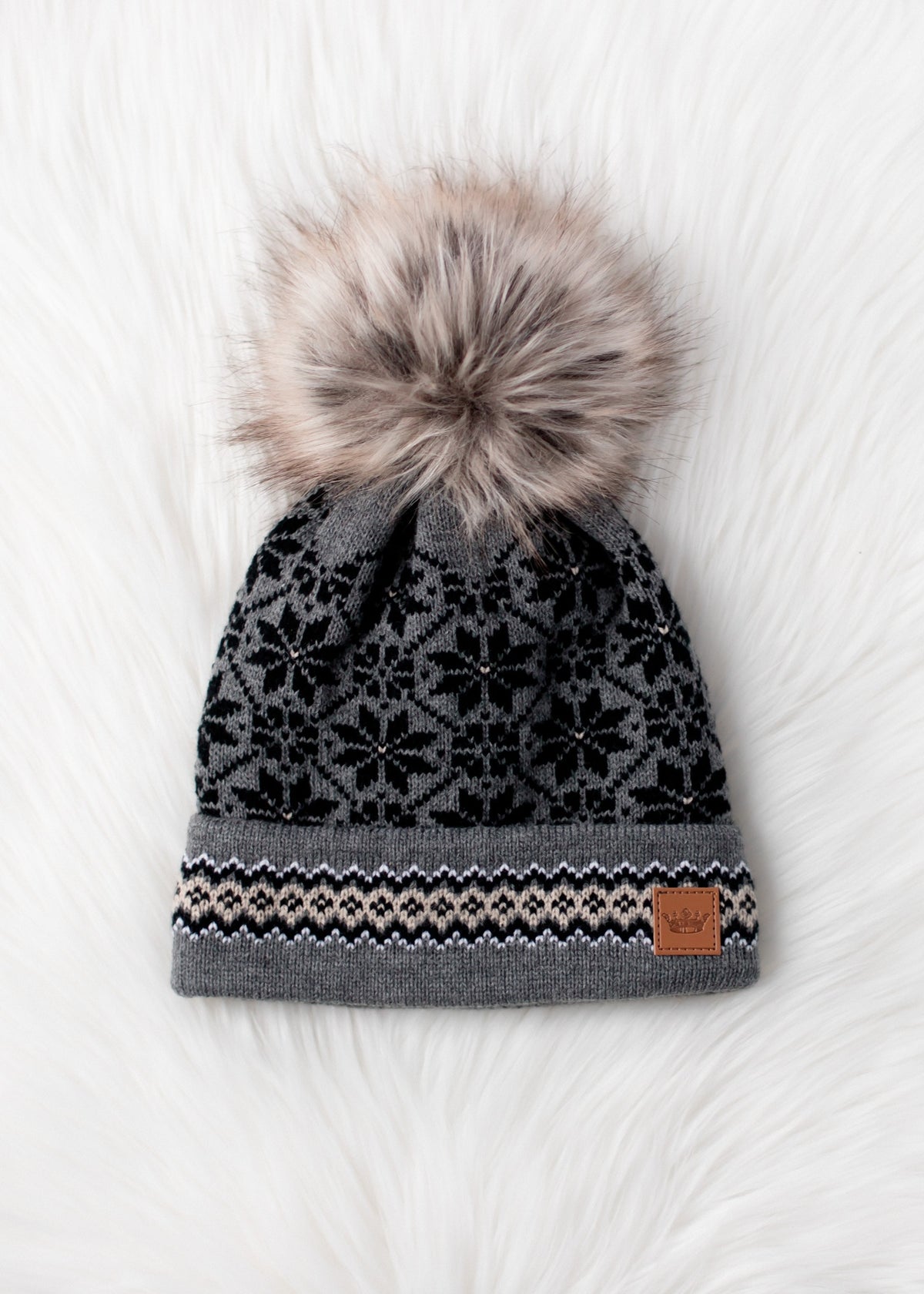 GREY, BLACK, AND TAN PATTERNED POM HAT