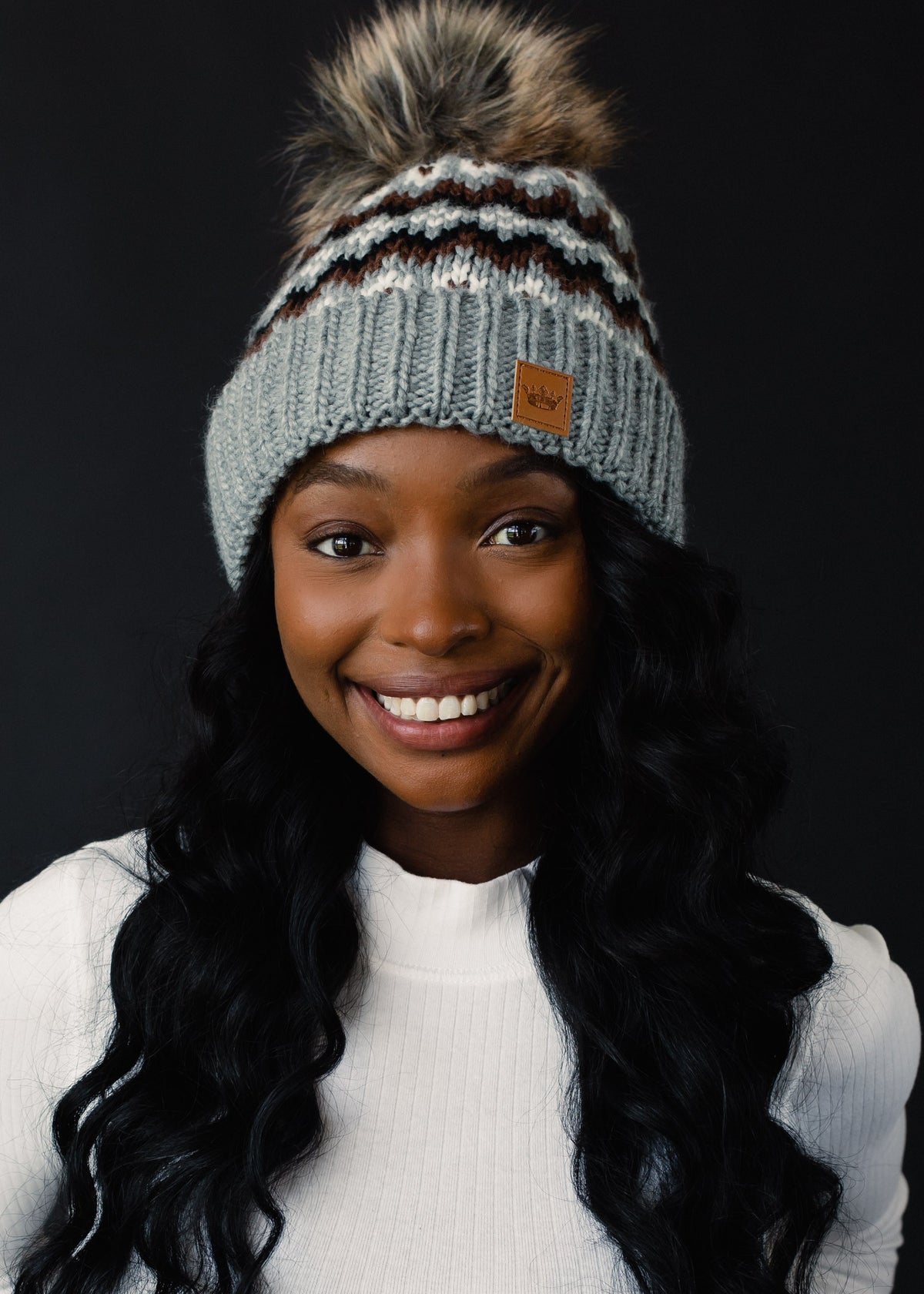 GRAY, BROWN, AND WHITE PATTERNED HAT