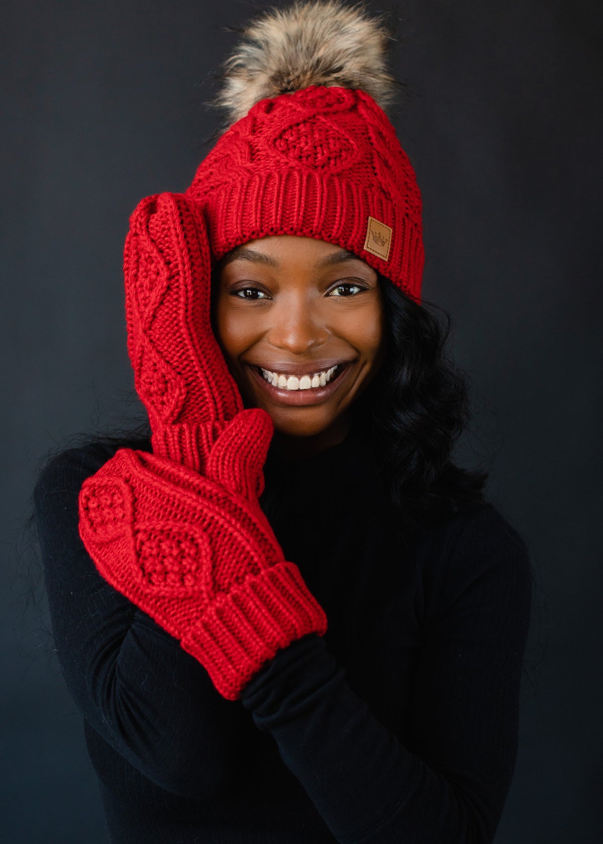 RED CABLE KNIT MITTENS