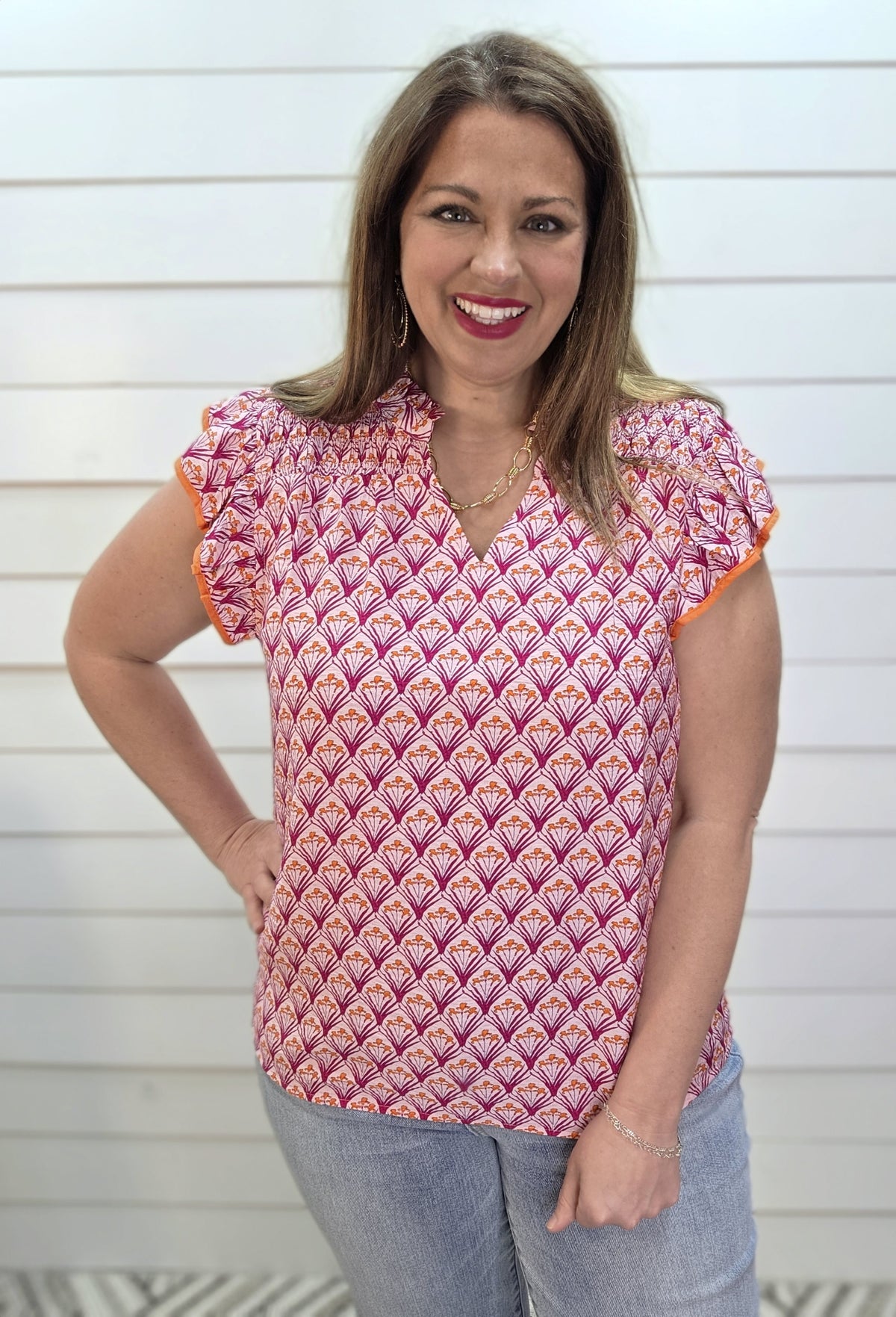 PINK/ORANGE PRINTED WOVEN TOP W/ RUFFLE SLEEVE