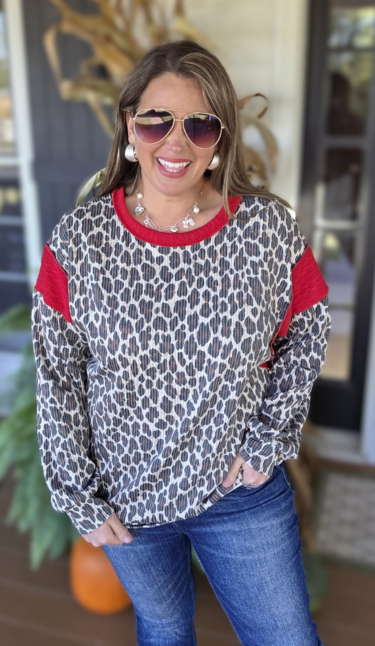 TAUPE ANIMAL PRINT RAISED RIBBED TOP WITH RED TRIM