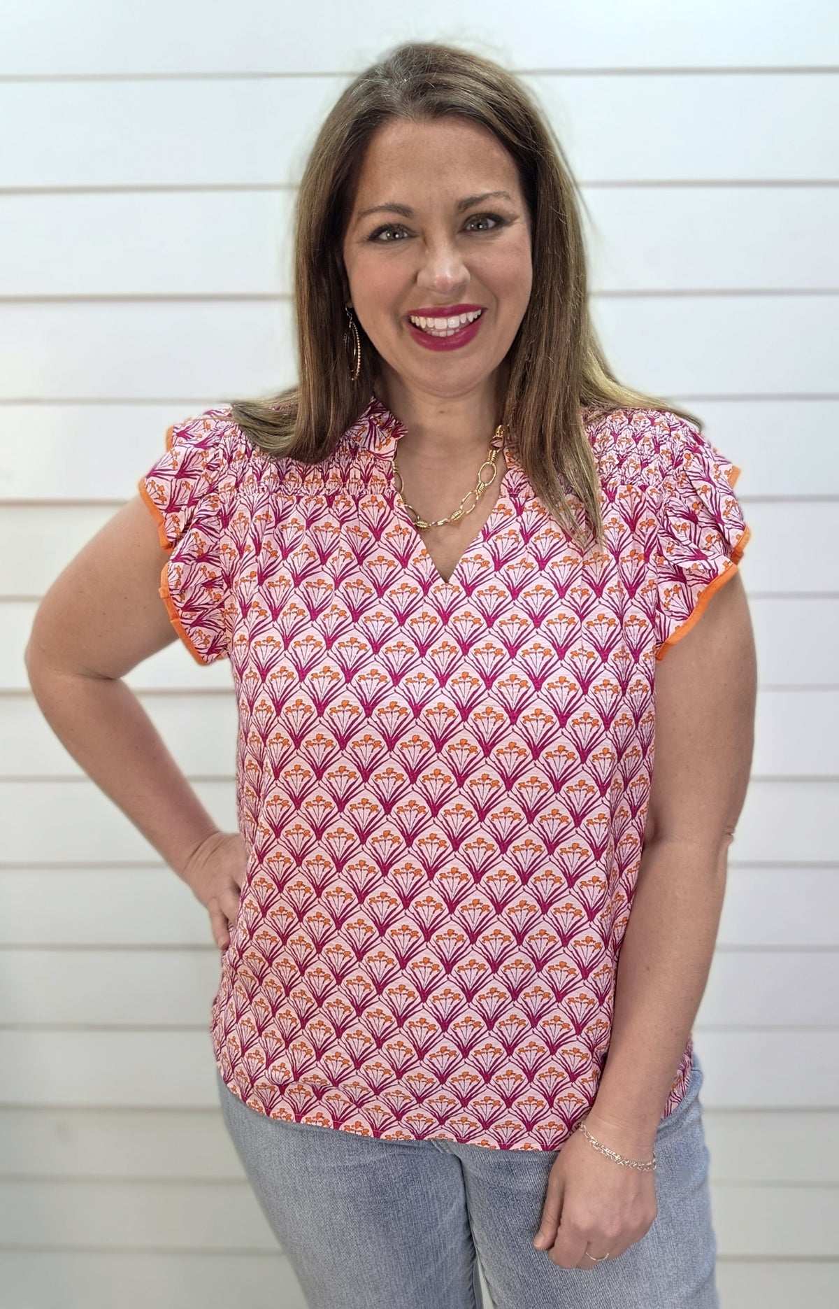 PINK/ORANGE PRINTED WOVEN TOP W/ RUFFLE SLEEVE