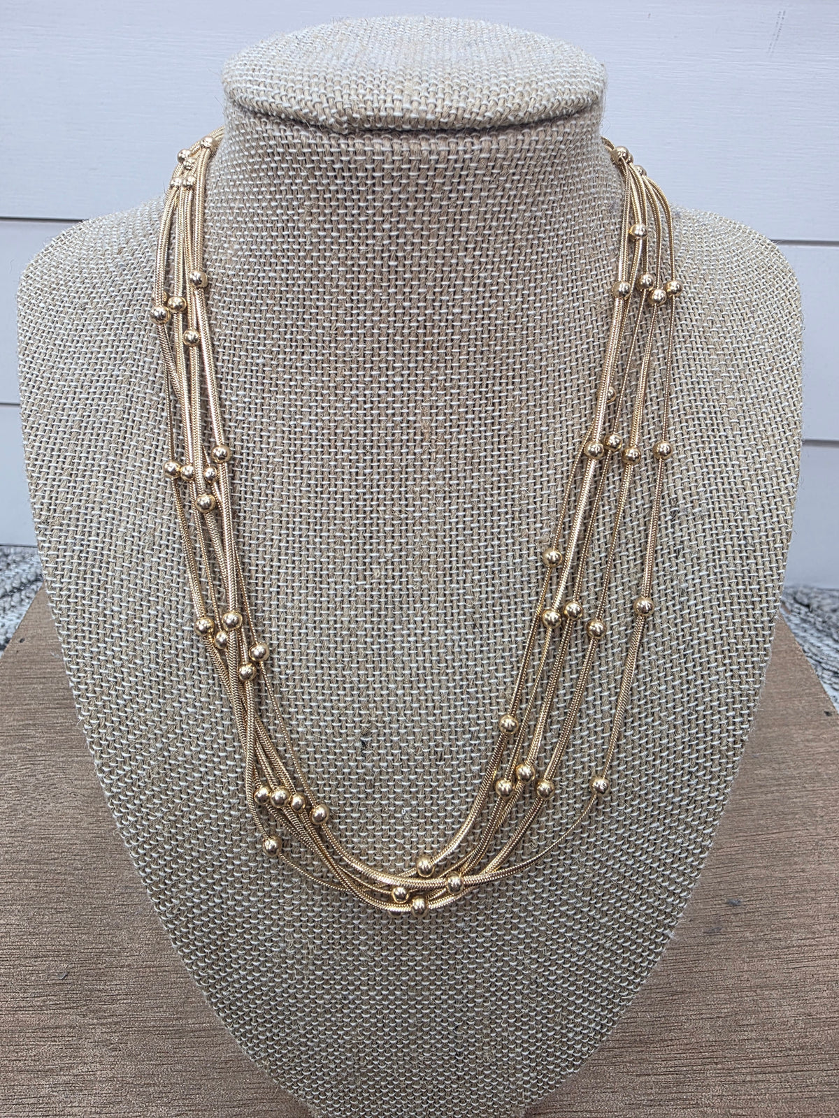 GOLD MULTI 5 STRAN BEADED NECKLACE