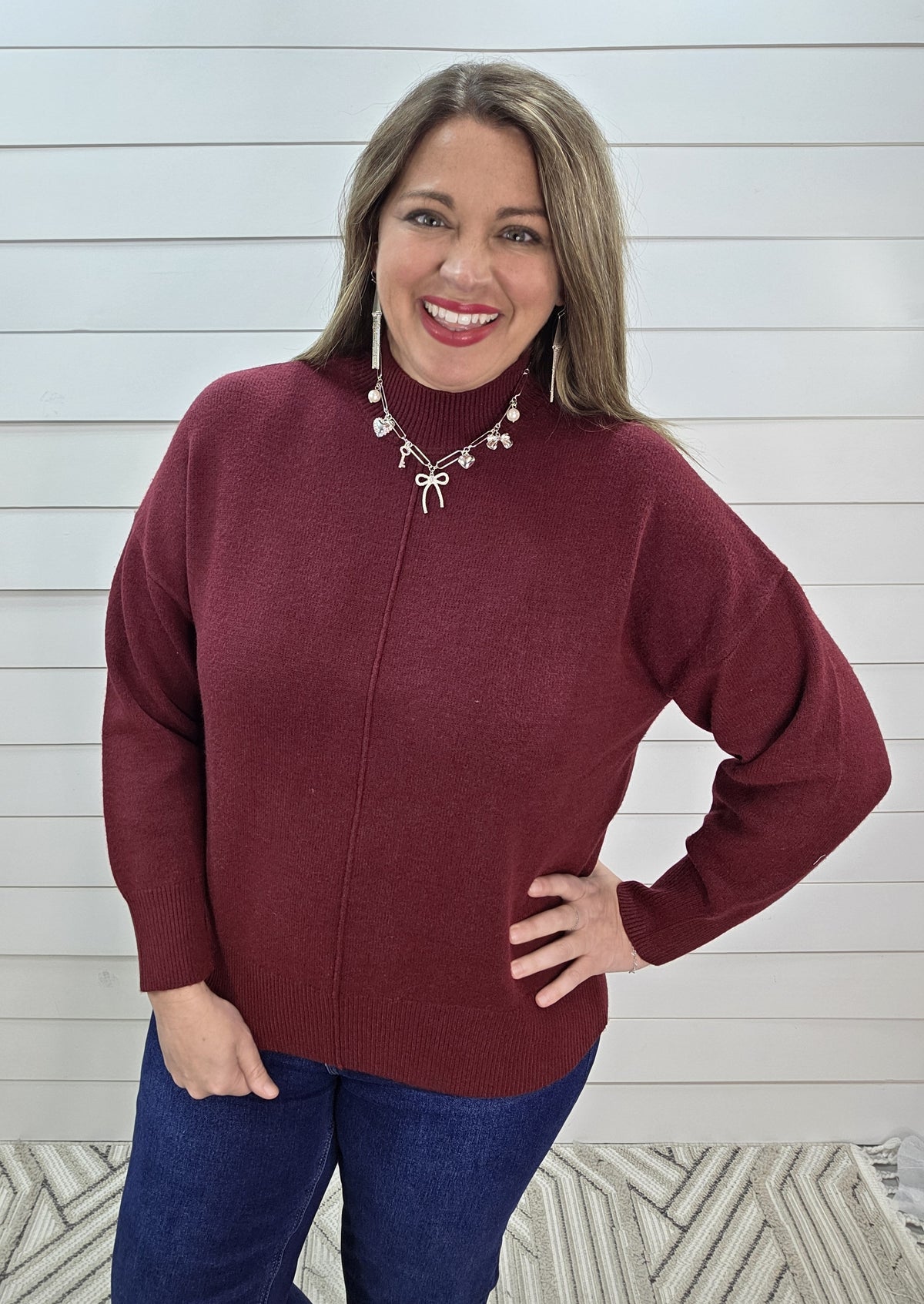 RED WOOD MOCK NECK CENTER SEAM SWEATER