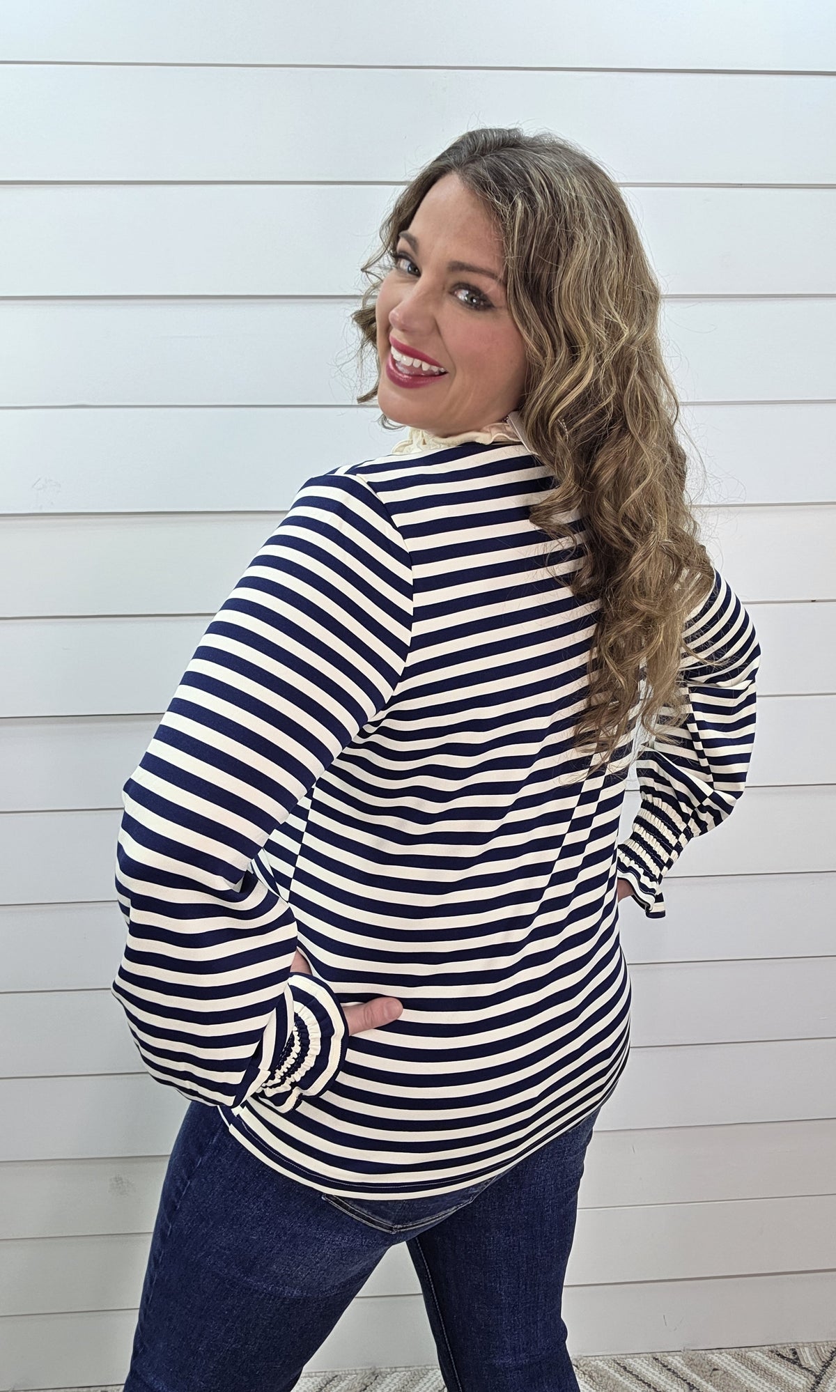 NAVY STRIPED HIGH RUFFLE NECKLINE WITH SMOCKED SLEEVES KNIT TOP