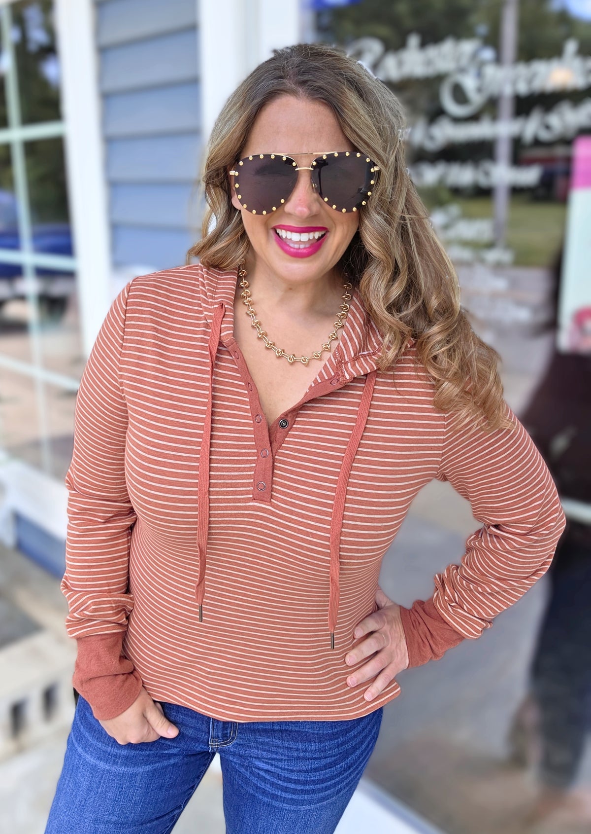 RUST STRIPED SNAP BUTTON HENLEY HOODED KNIT TOP