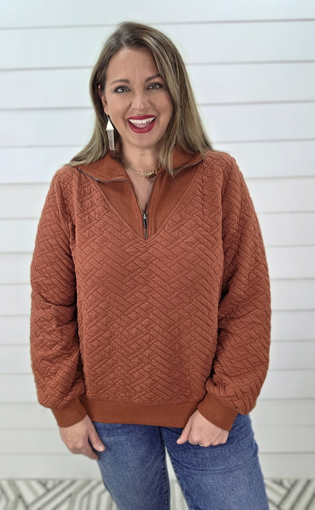 RUST QUILTED QUARTER ZIP PULLOVER