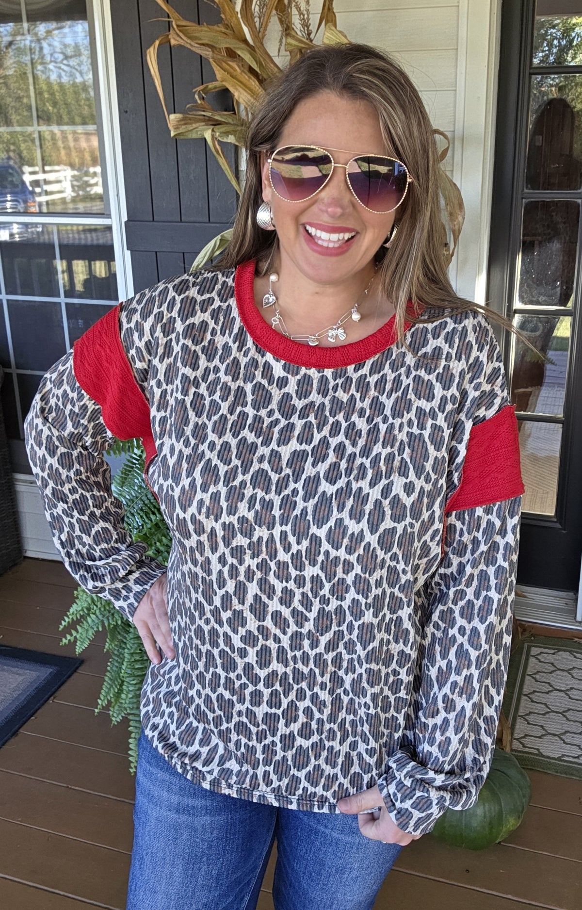 TAUPE ANIMAL PRINT RAISED RIBBED TOP WITH RED TRIM