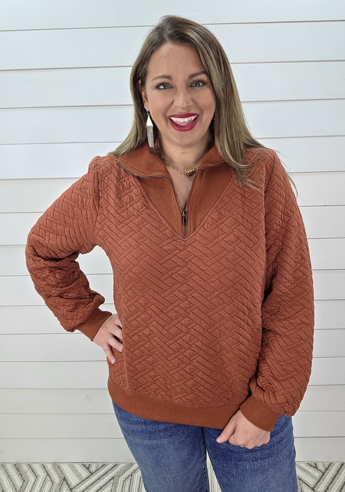RUST QUILTED QUARTER ZIP PULLOVER