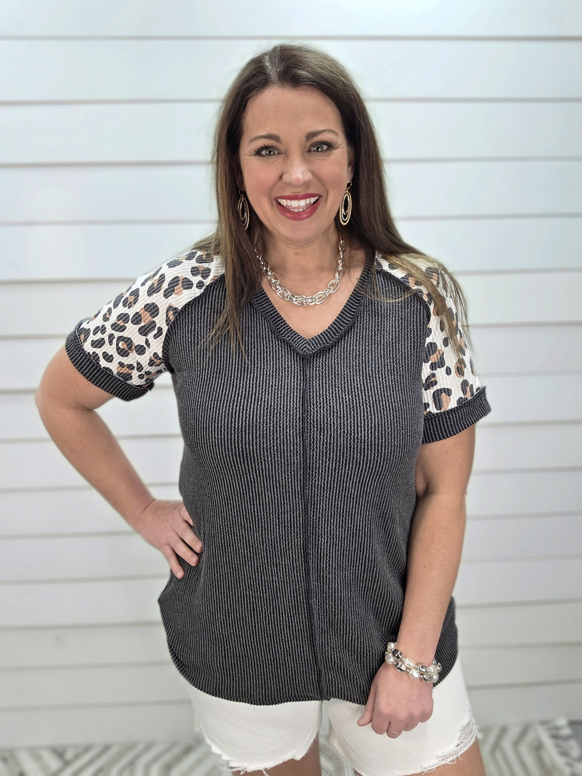 BLACK RAISED RIBBED KNIT TOP W/ LEOPARD SLEEVES AND CENTER SEAM