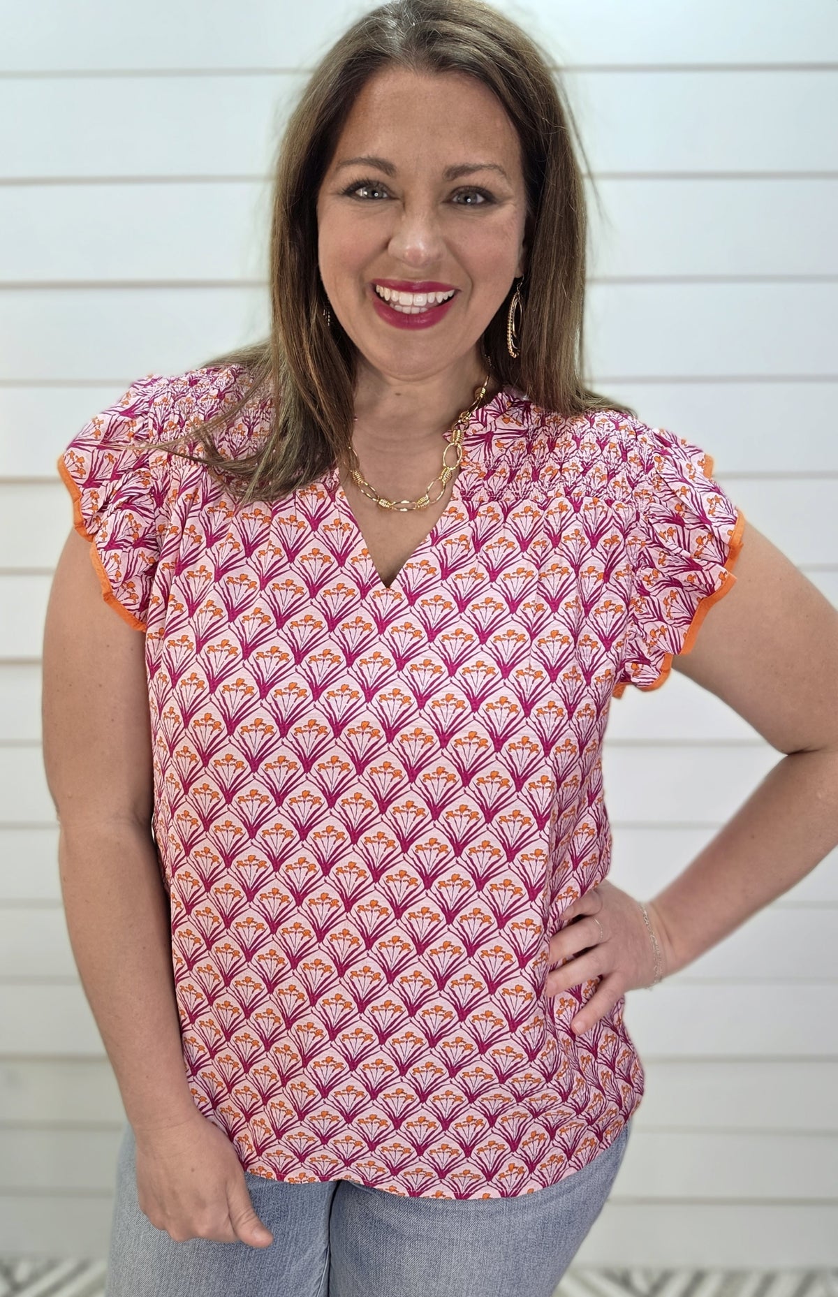 PINK/ORANGE PRINTED WOVEN TOP W/ RUFFLE SLEEVE