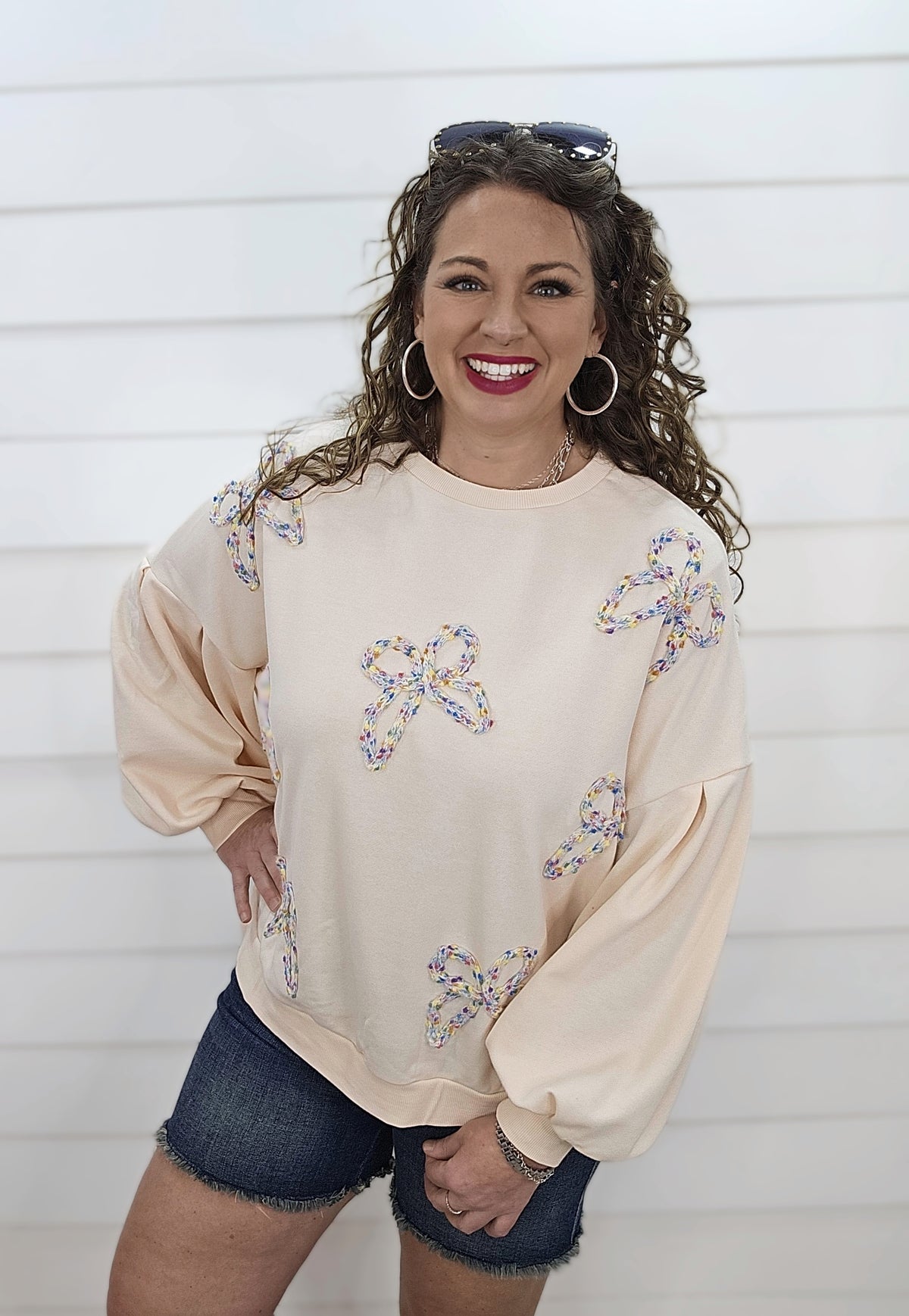 CREAM PULLOVER SWEATSHIRT W/ MULTI COLOR KNIT BOWS