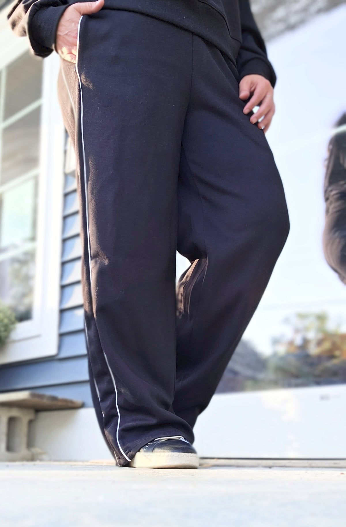 BLACK PINSTRIPED KNIT ATHLEISURE PANTS WITH SIDE POCKETS