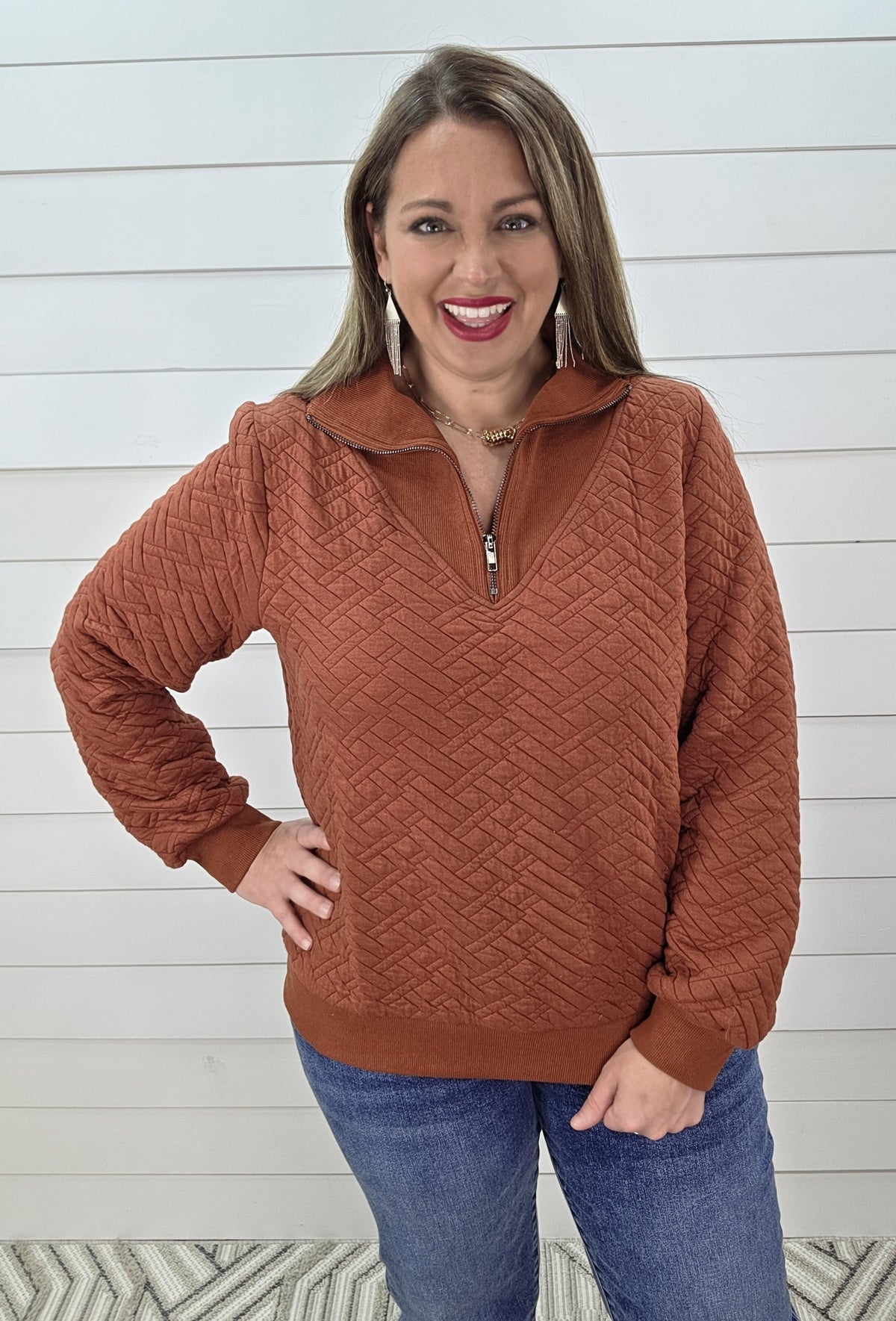 RUST QUILTED QUARTER ZIP PULLOVER
