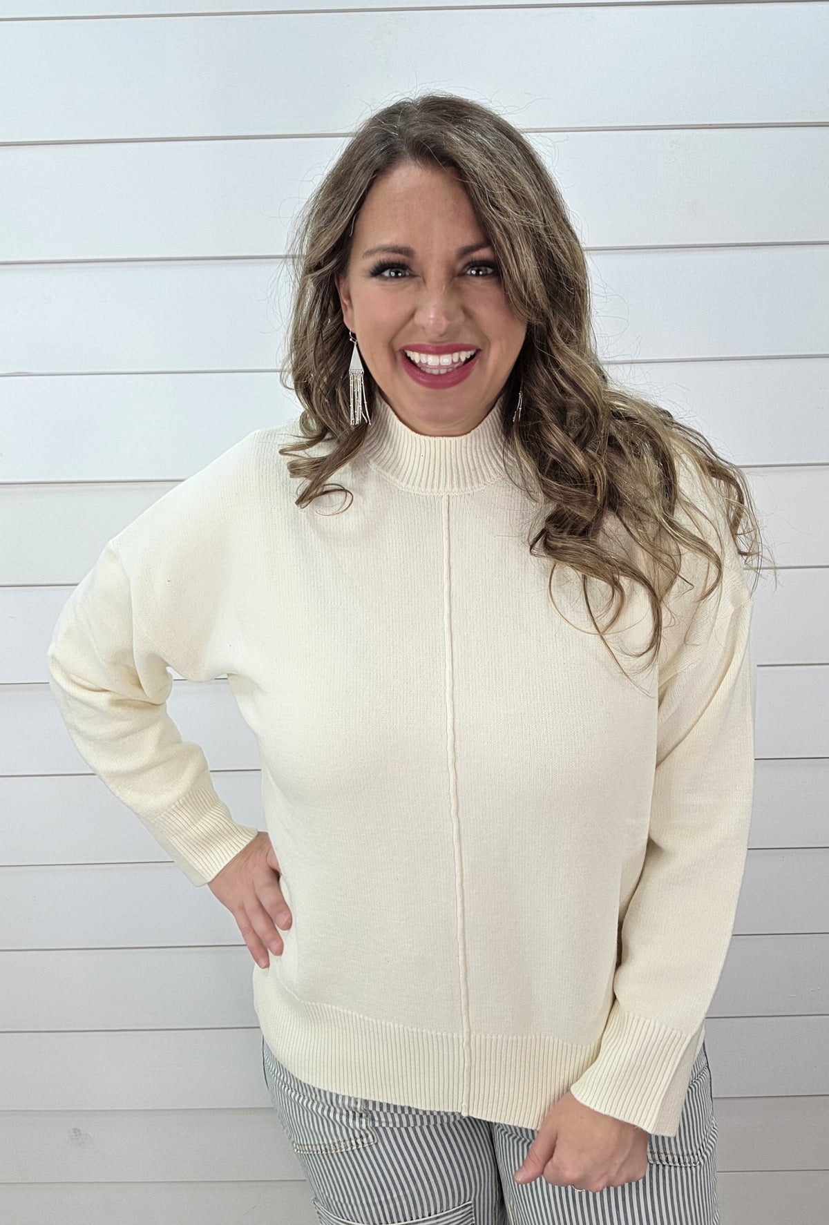 CREAM CENTER SEAM MOCK NECK SWEATER