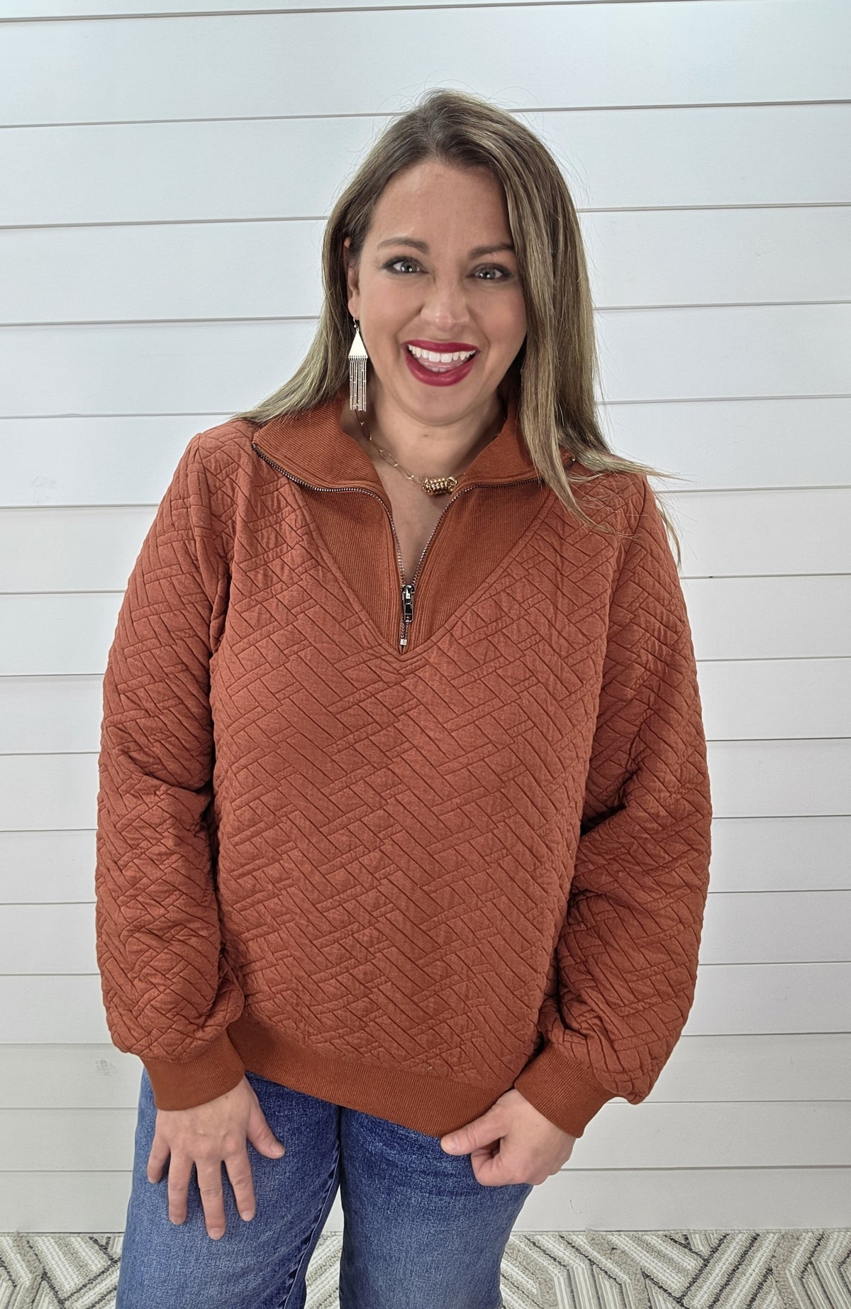 RUST QUILTED QUARTER ZIP PULLOVER