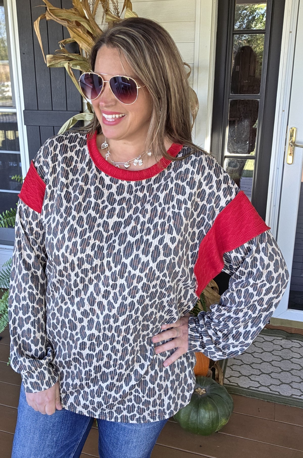 TAUPE ANIMAL PRINT RAISED RIBBED TOP WITH RED TRIM