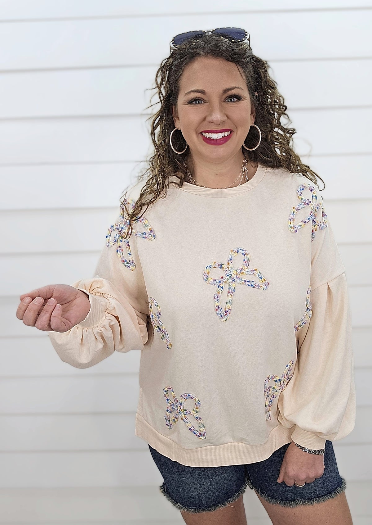 CREAM PULLOVER SWEATSHIRT W/ MULTI COLOR KNIT BOWS