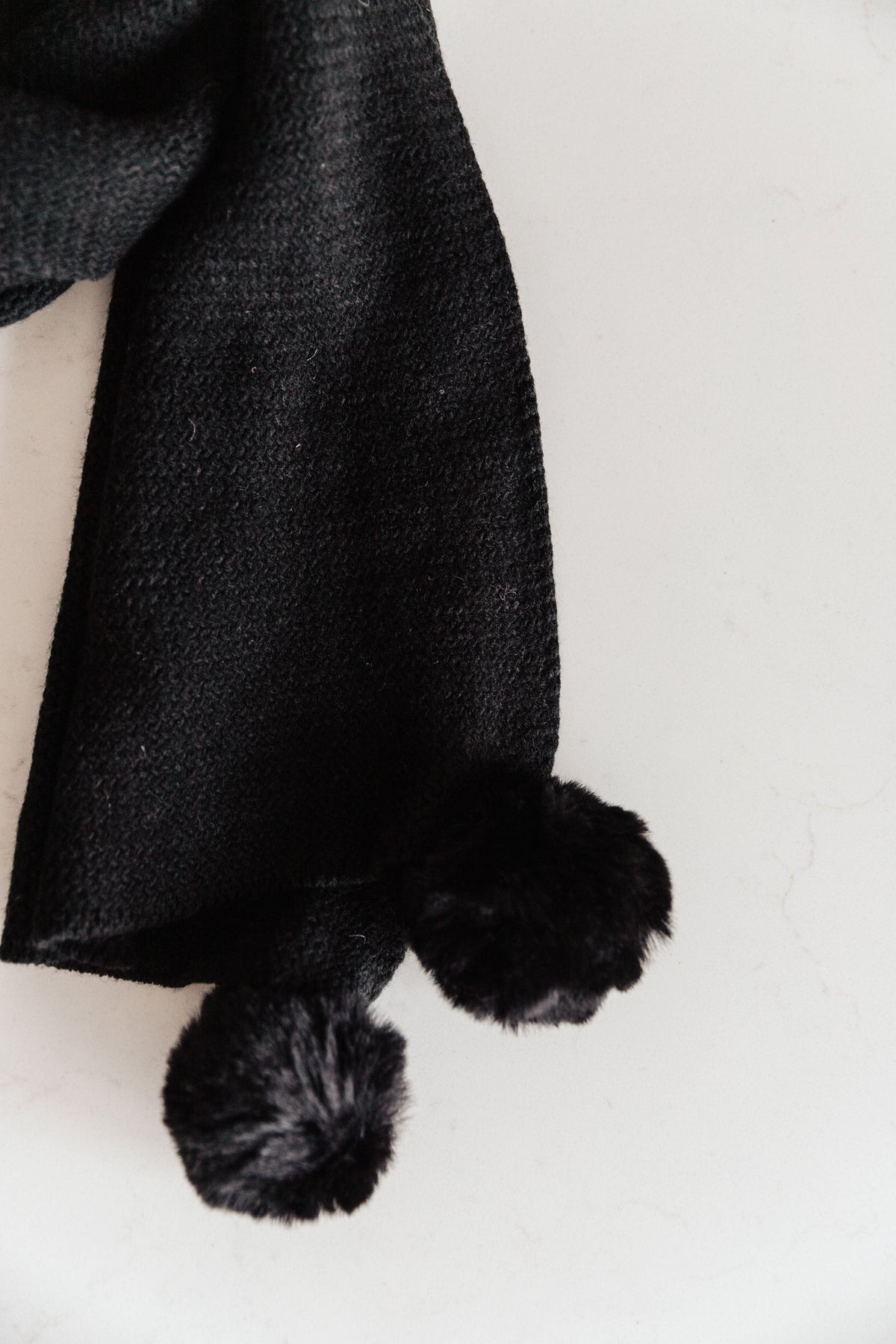 Knitted Fuzzy Pom Pom Scarf In Black - final sale